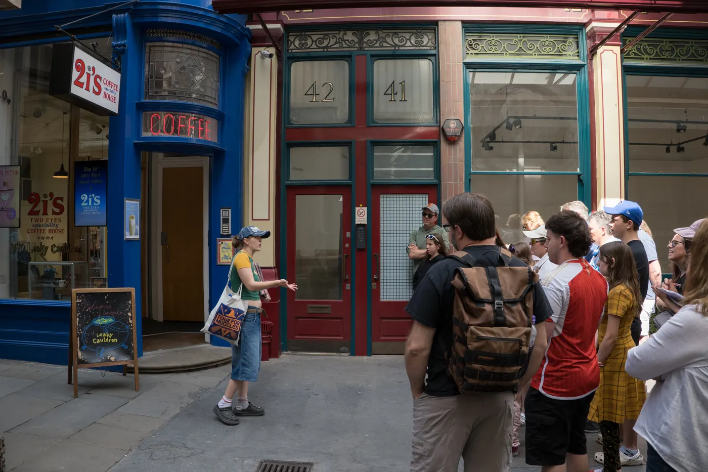 Two delighted guests smile as they hold a wand during the tour