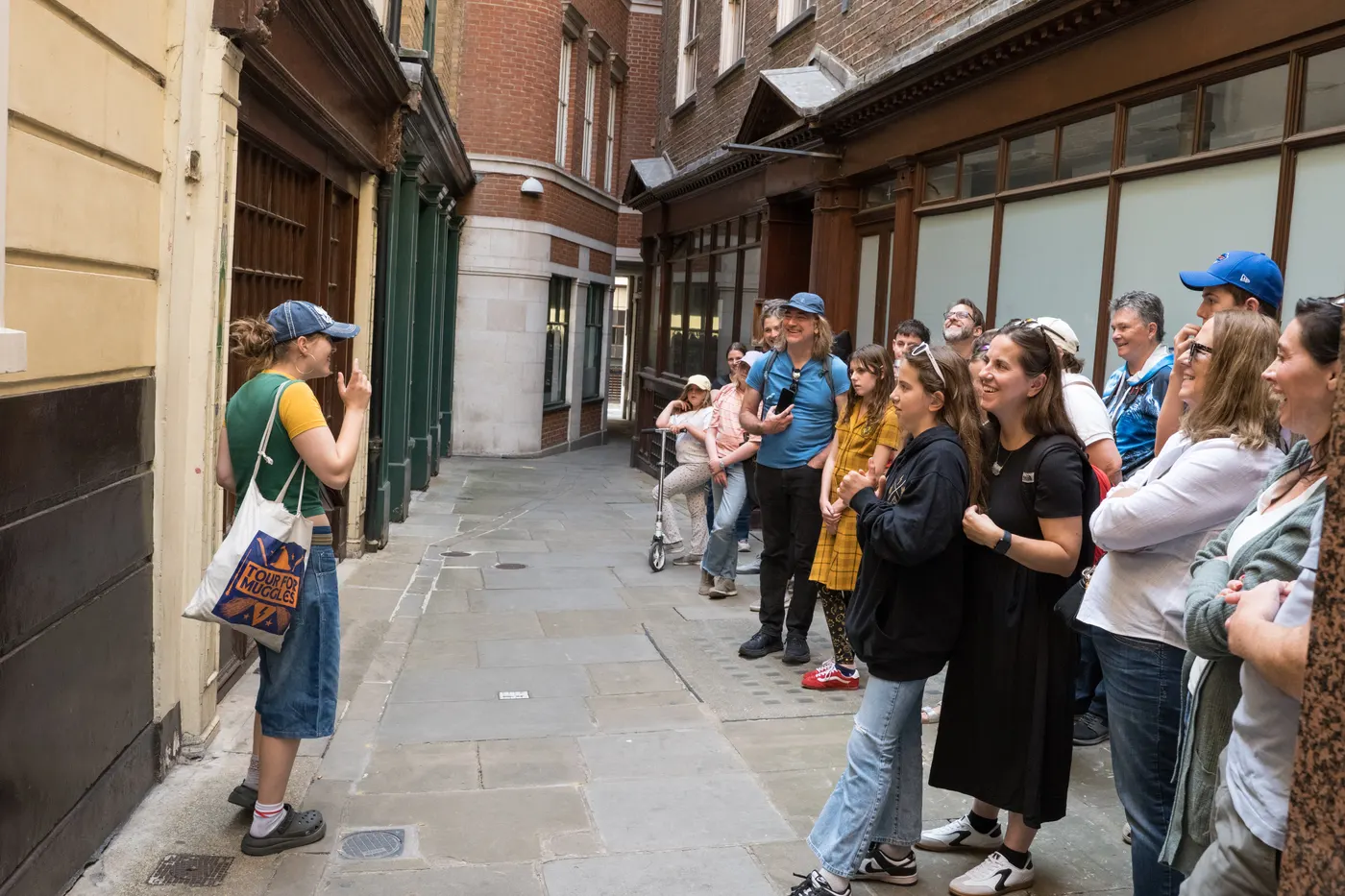 A Tour for Muggles guide performs a scene for the group inside Leadenhall Market, a Harry Potter film location